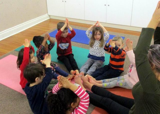 Children engaging in yoga with Cheeba