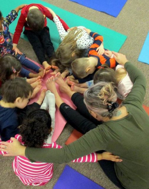 Children engaging in yoga with Cheeba