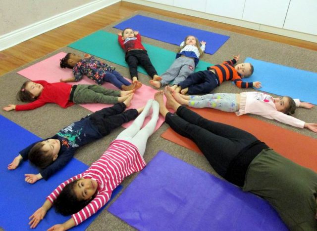 Children engaging in yoga with Cheeba