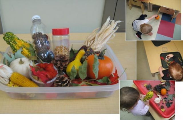 Children under 2 exploring Fall sensory materials