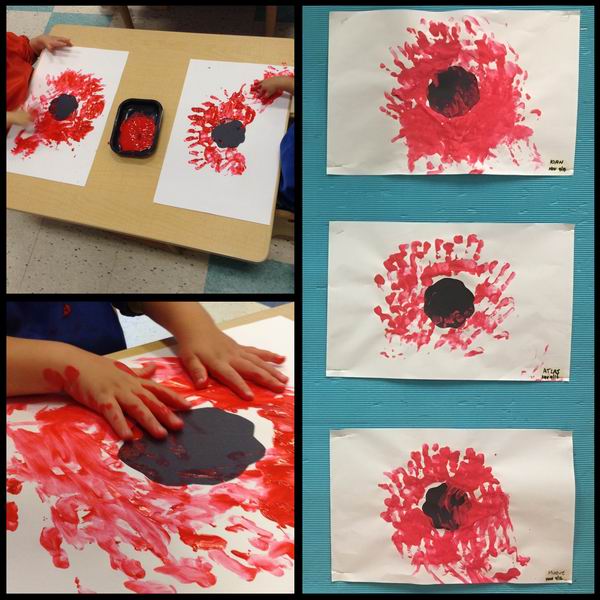 Children painting a poppy
