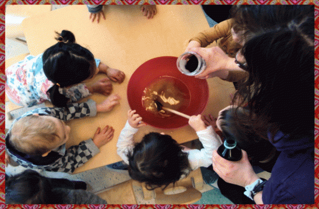 Children stirring cookie mixture