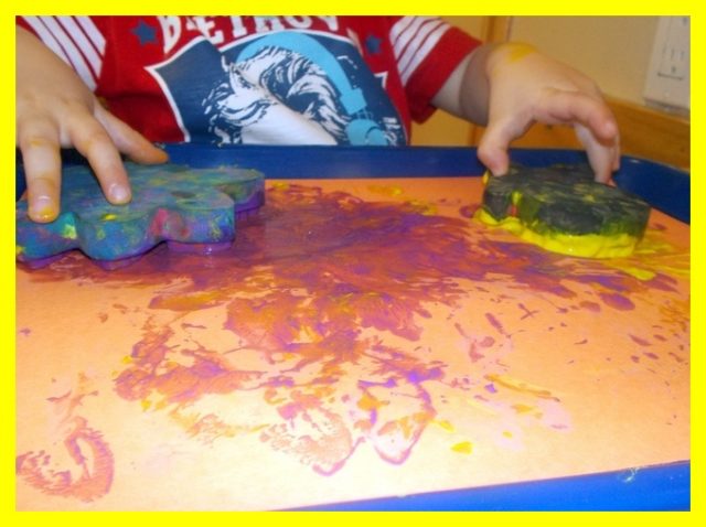 Child under 2 sponge painting