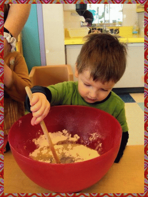 Child stirring cookie mixture