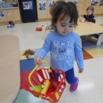 Child under 2 with a shopping basket