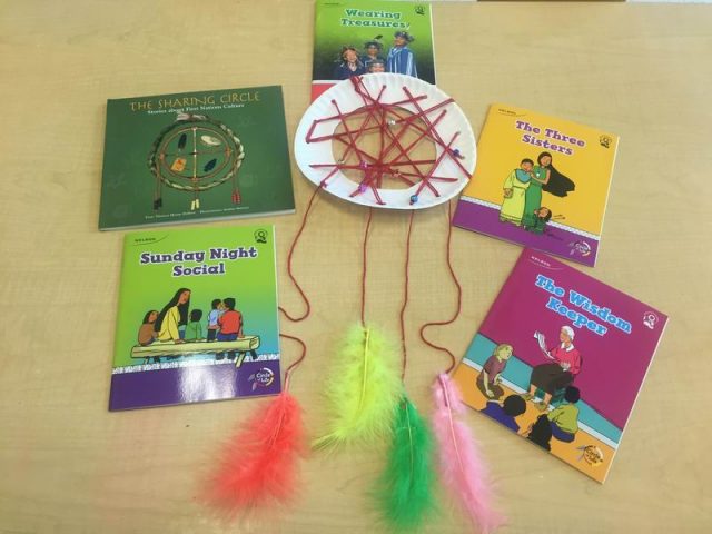 A finished dream catcher and books about Aboriginal culture