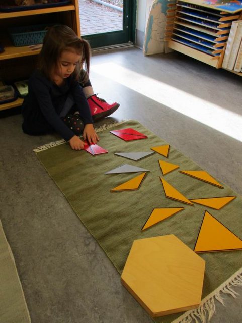 Child working with constructive triangles