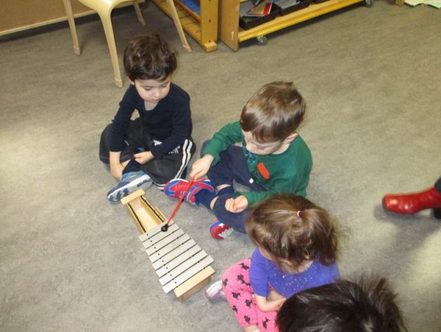 Child playing the metallophone