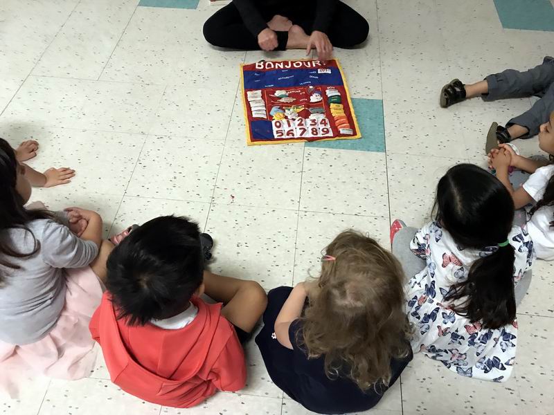 Children learning French during circle time