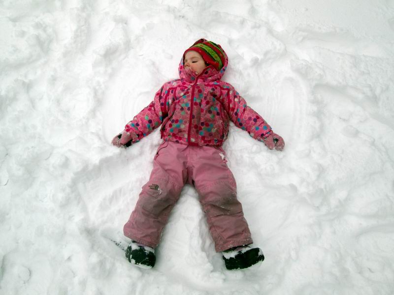 Child making a snow angel