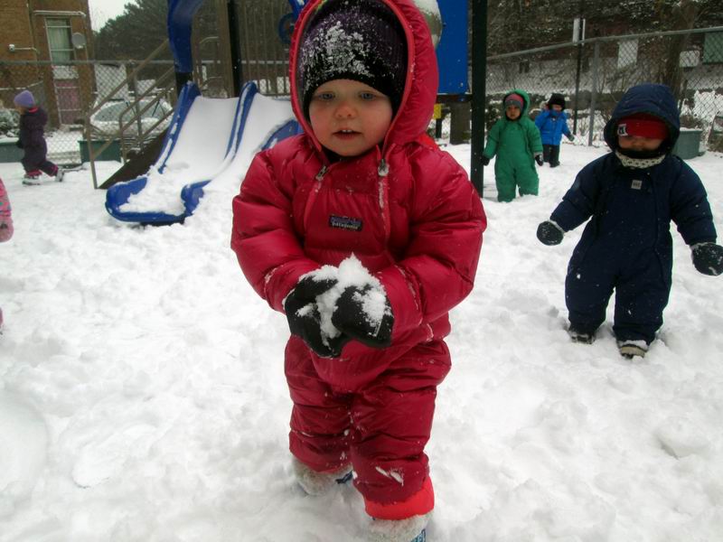 Child making a snowball