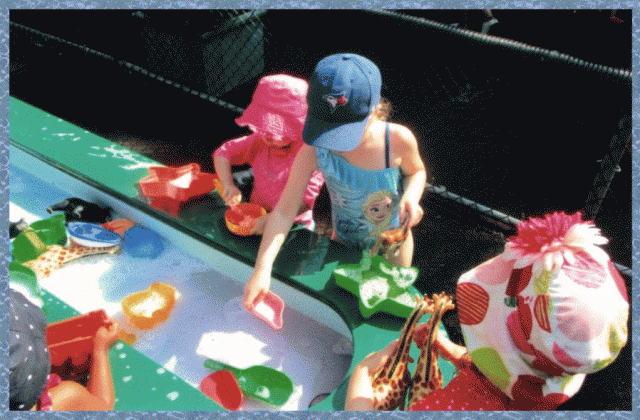 Children playing at the water table
