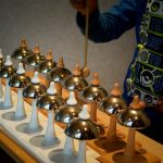 Casa child playing Montessori bells