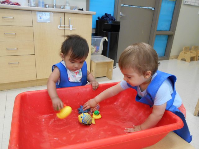 Children under 2 playing with water