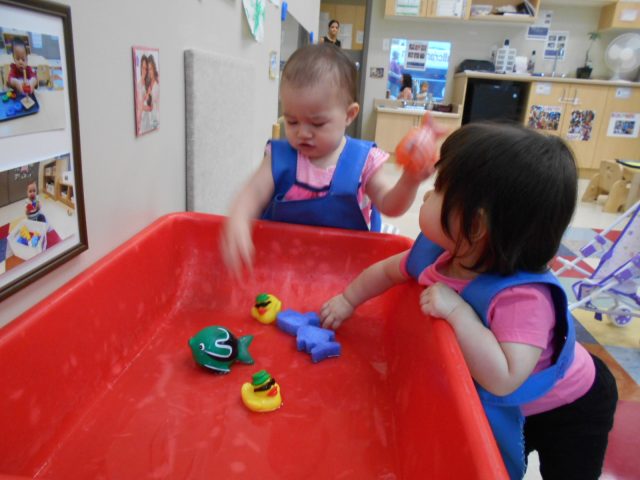 Children under 2 playing with water