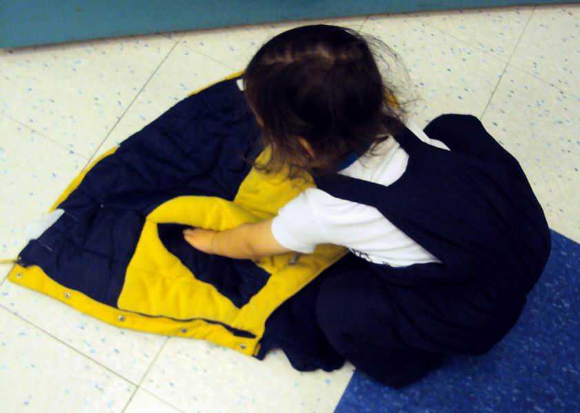Child flipping on a coat