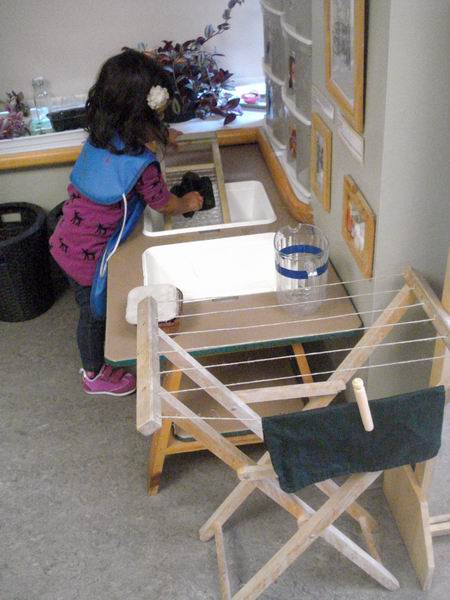 Child washing dishes