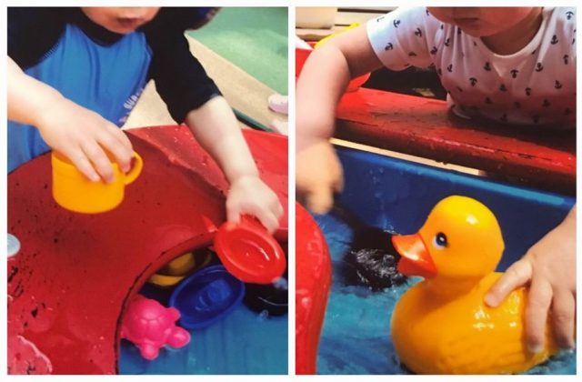 Children under 2 playing with toys in a water table