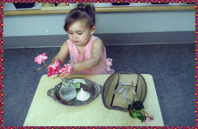 Child arranging fresh flowers in a vase