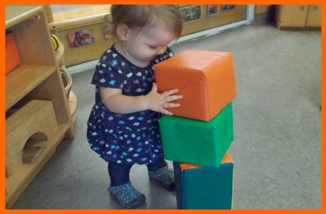 Child under 2 stacking large soft blocks