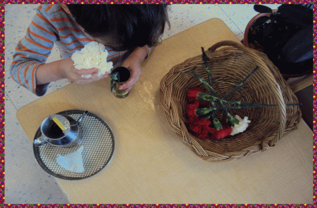 Child arranging fresh flowers