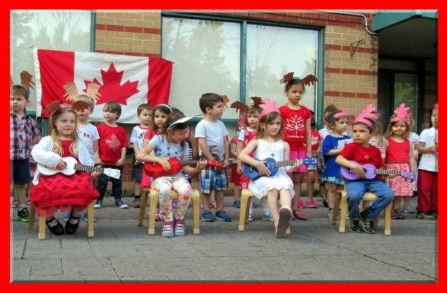 Children playing the ukulele during the Canada 150 celebration