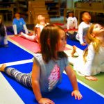Casa children practicing yoga