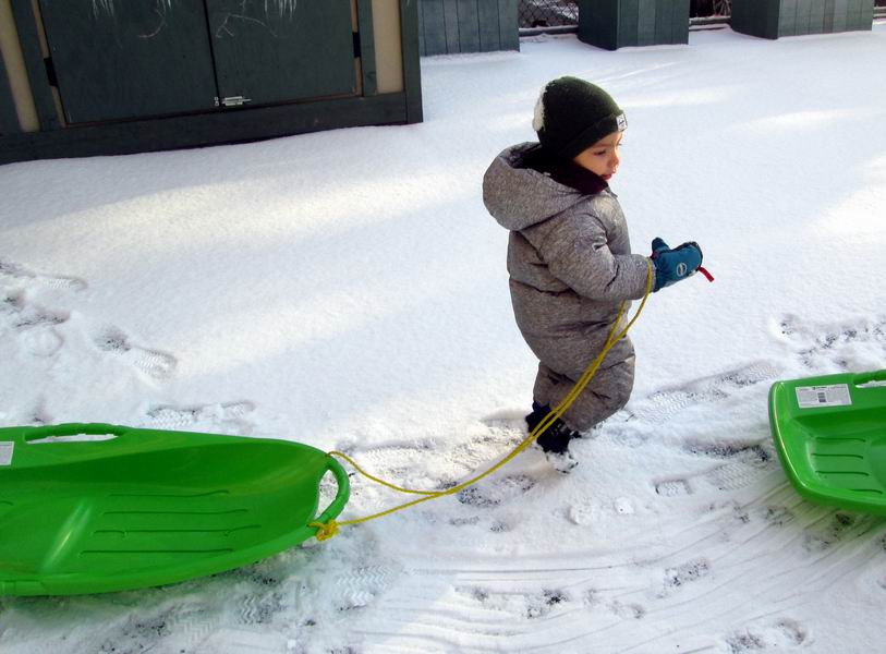 Child Under 2 pulling a sled