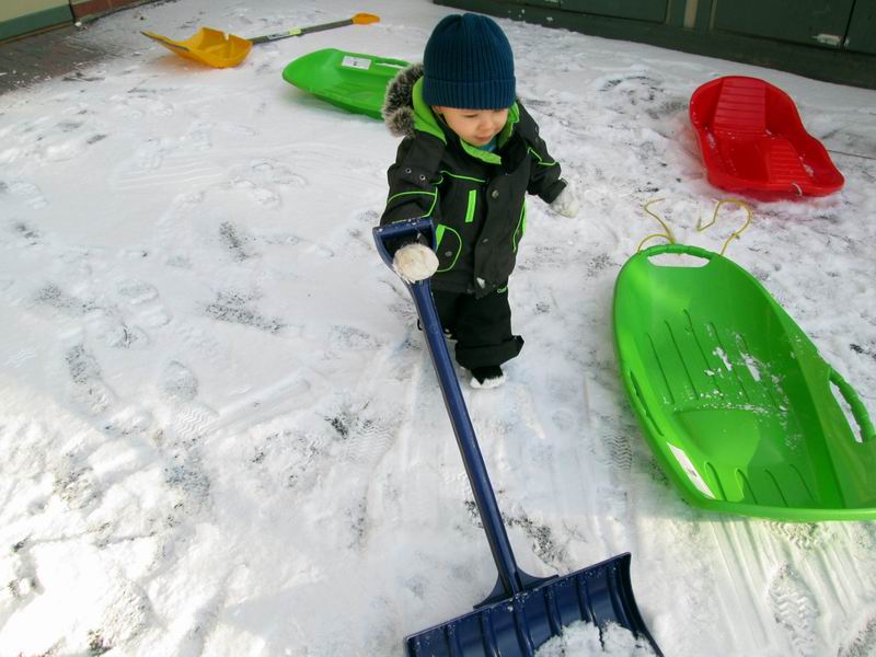 Child Under 2 shoveling snow