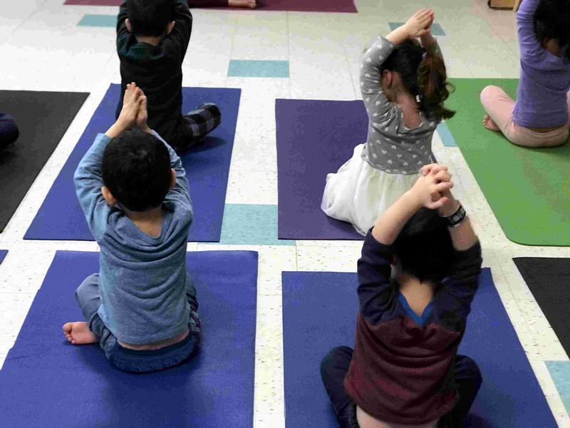 Children practicing yoga