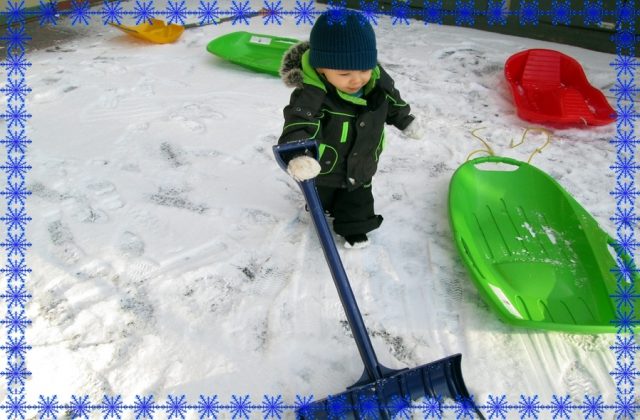 Child under 2 shoveling snow