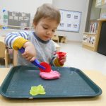 Child under 2 exploring playdough