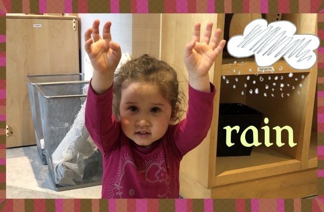 Child under 3 signing 'rain'.