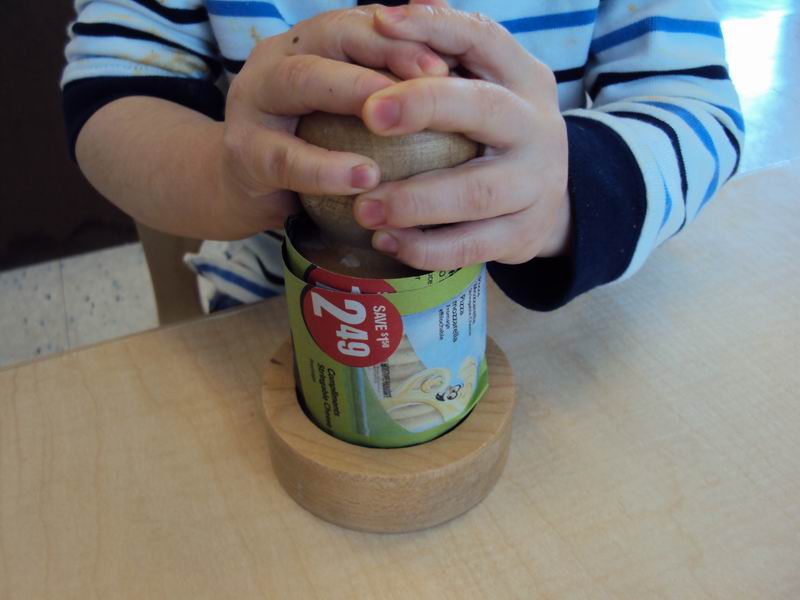 A child making a biodegradable planter