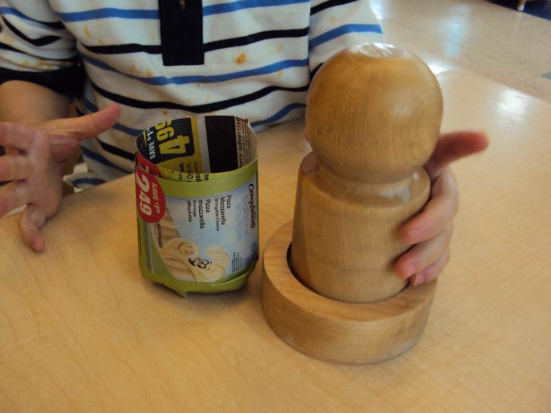 A child making a biodegradable planter