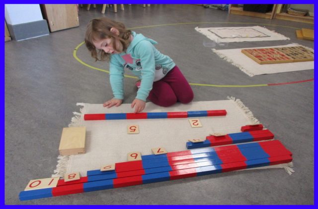 Child working on addition with Number Rods
