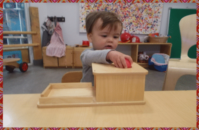 Child Under 2 using a ball and tray