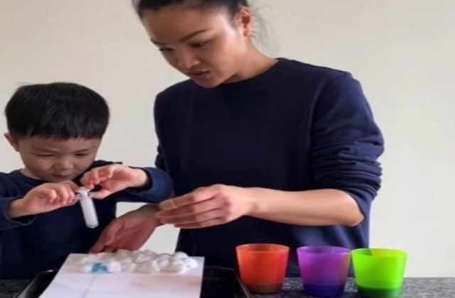 Amy and her son making Rain Cloud Art