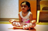 Child practicing yoga