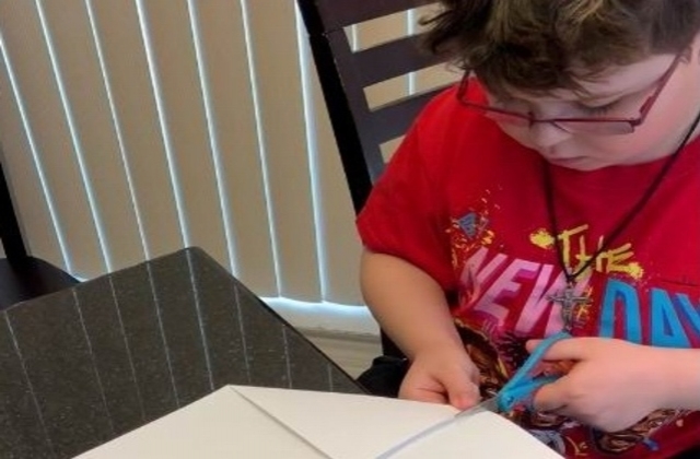 Antonietta's son making a 'cootie catcher'