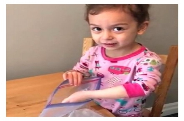 Brianne's daughter putting beans in a baggie