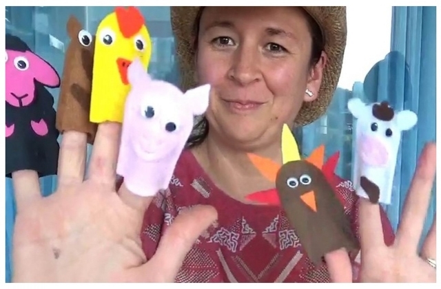 Blanca with farm finger puppets