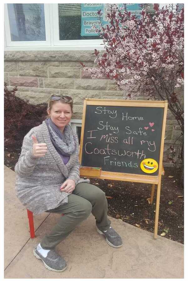 Jen with a motivational sign