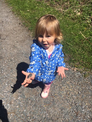 child showing something on her hand