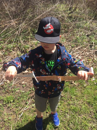 child holding a Birch tree bark