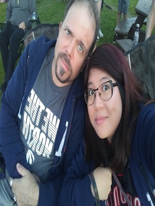 Maria and Richard wearing Raptors shirts