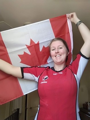 Maria holding a Canada flag