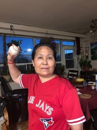 Kalsang wearing a Blue Jays jersey