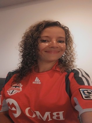 Meagan wearing a Toronto FC jersey