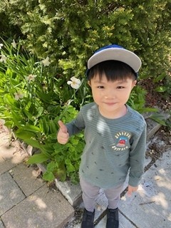 Benji posing with flowers